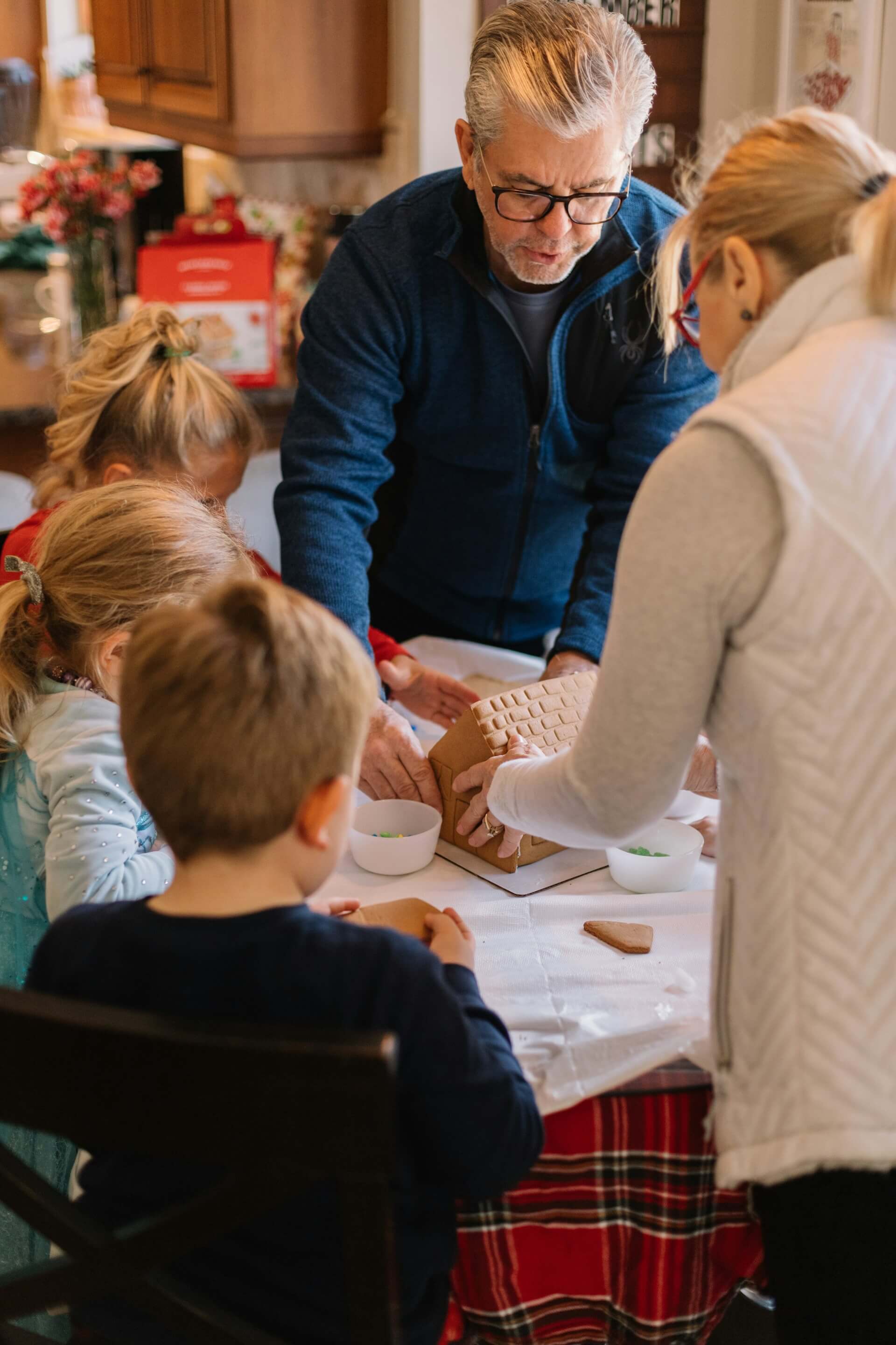 family baking cake with children